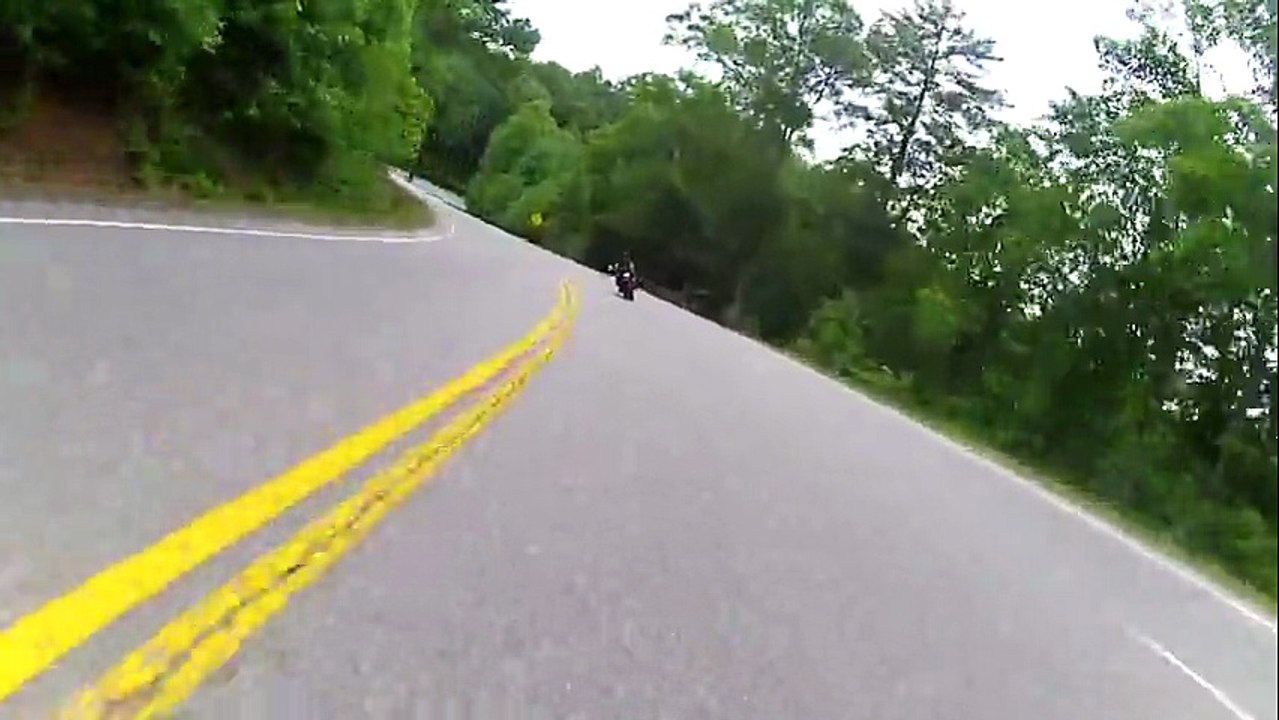 Motorcycle rider loses control during tight turn