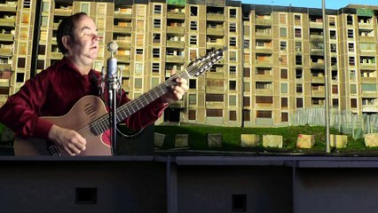 me singing Running To Stand Still by U2