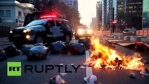 RAW- Police brutally clash with protesters at transport hike demo in Brazil