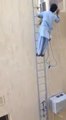 Tallest ladder ever : crazy indian guy working so so high!