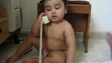 Cute baby has intense phone conversation
