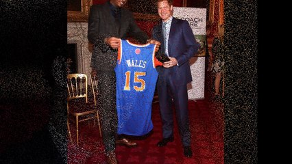 Prince Harry is dwarfed by NBA basketball star Carmelo Anthony during reception at St James's Palace