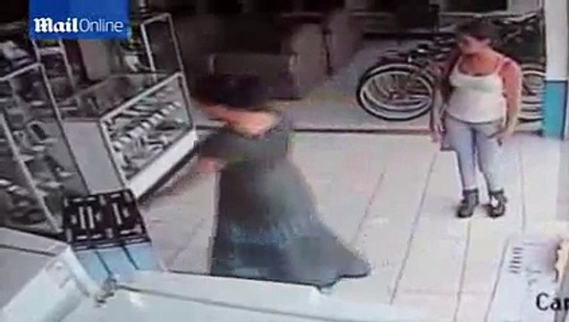 CCTV captures woman stuffing a plasma TV up her skirt