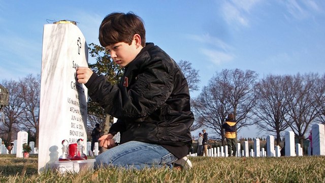 Young brothers visit warrior dad at Arlington National Cemetery