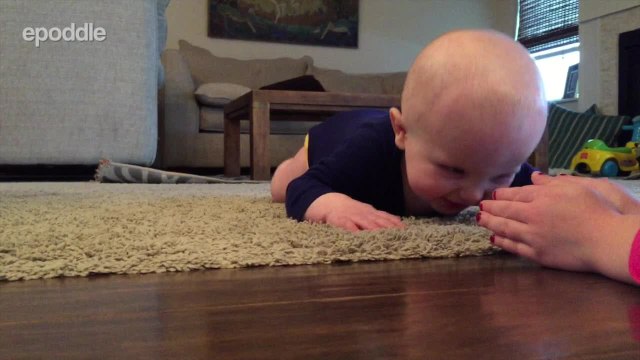 Baby laughs hysterically at rolling ping pong ball