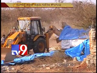 Revenue officers destroy illegal huts in Rangareddy