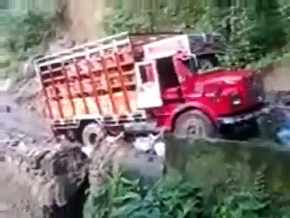 Truck falls off cliff due to land slide.