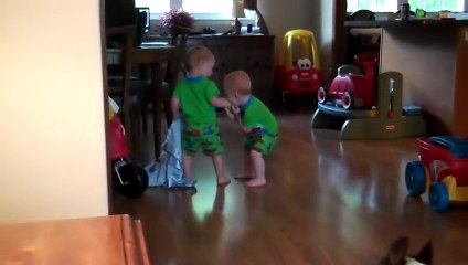 Twin boys playing with their Boston Terrier