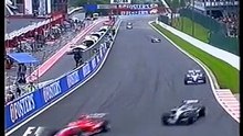 Kimi Räikkönen overtaking Michael Schumacher in Eau Rouge Spa 2004