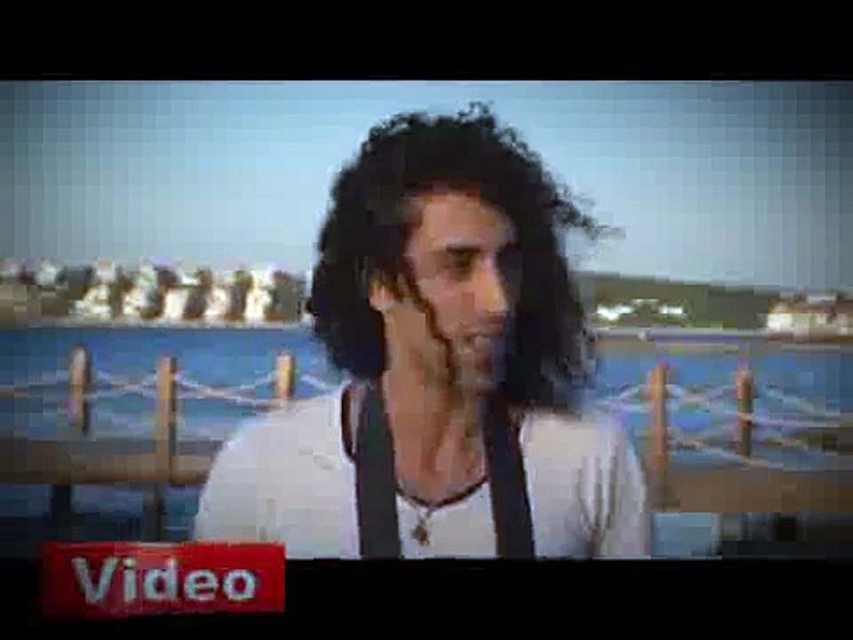 The bride and groom jumped in the sea, hand in hand with The bride and groom jumped into the sea