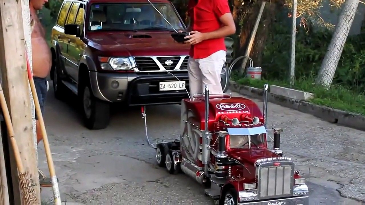 Amazing RC truck pulling a real SUV car
