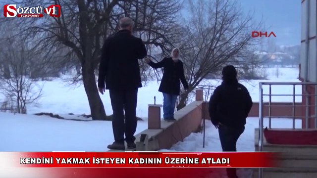 Kendini yakmak isteyen kadının üzerine atladı