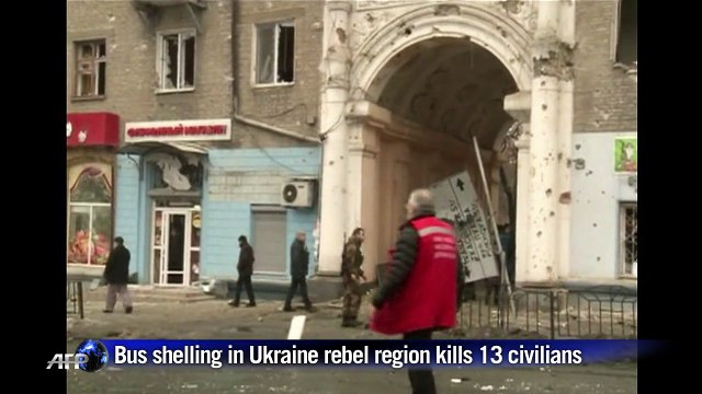 Rebels parade Ukrainian POWs through shelled city