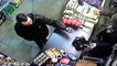 Incredible moment fearless Muslim shopkeeper snatches gun out of thief's hand before chasing him out of the store