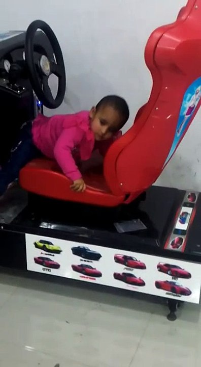 the two baby girls jumping and playing in the playland