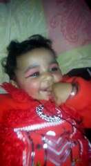 the baby is laughing and playing