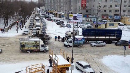 Army tank tows truck in Russiaa