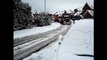 big rig truck pulls 18 wheeler uphill in snow