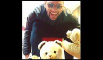 Dani Alves kisses the bear trainers that Lionel Messi mocked him for