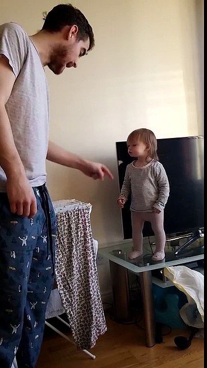 Adorable daddy daughter standoff