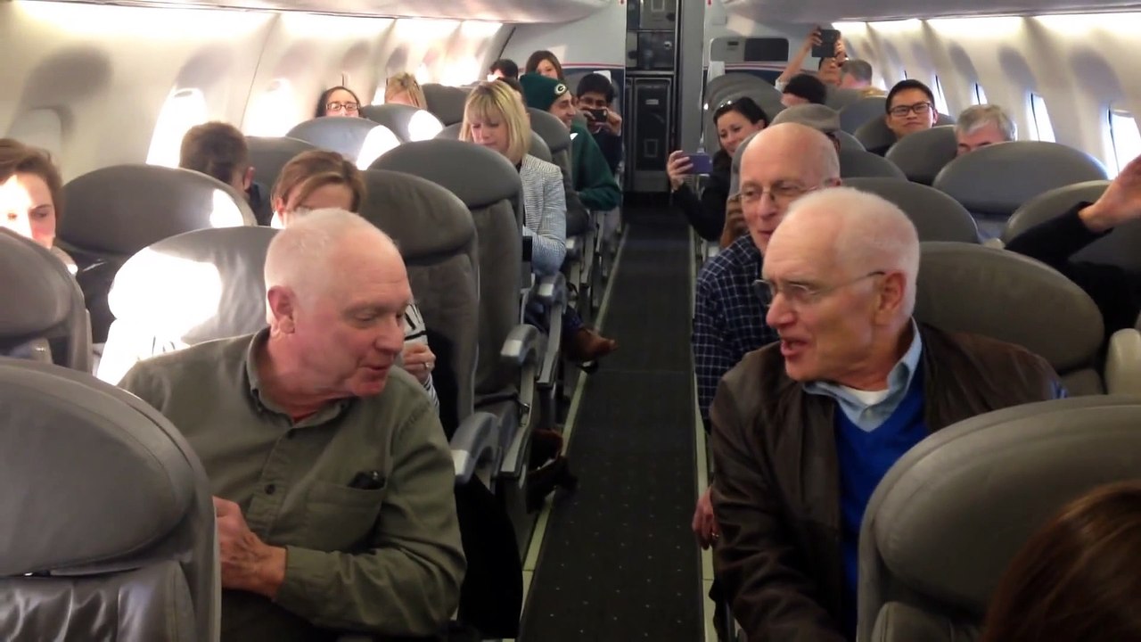 Talented barbershop quartet handles a plane delay by singing!