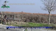 Kobane: Syrian rebels and Kurdish flags on a hill