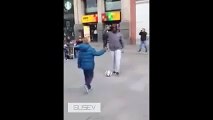 Cristiano Ronaldo dresses up as a beggar and doing keepy uppies with a child in Madrid 2015