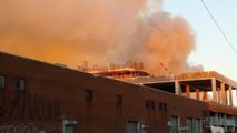 Plumes of smoke rise from Brooklyn warehouse fire