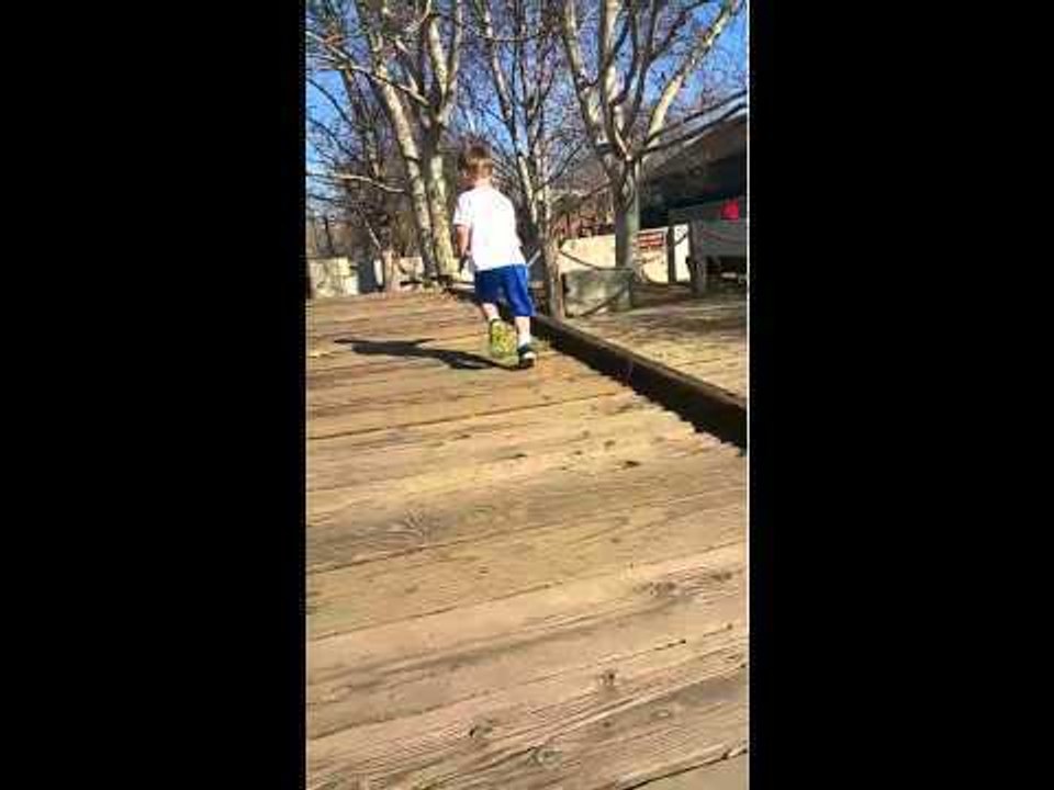 Eager Boy Falls at Top of Boardwalk