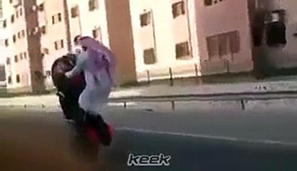 watch this Arabic man with one wheeling on bike.