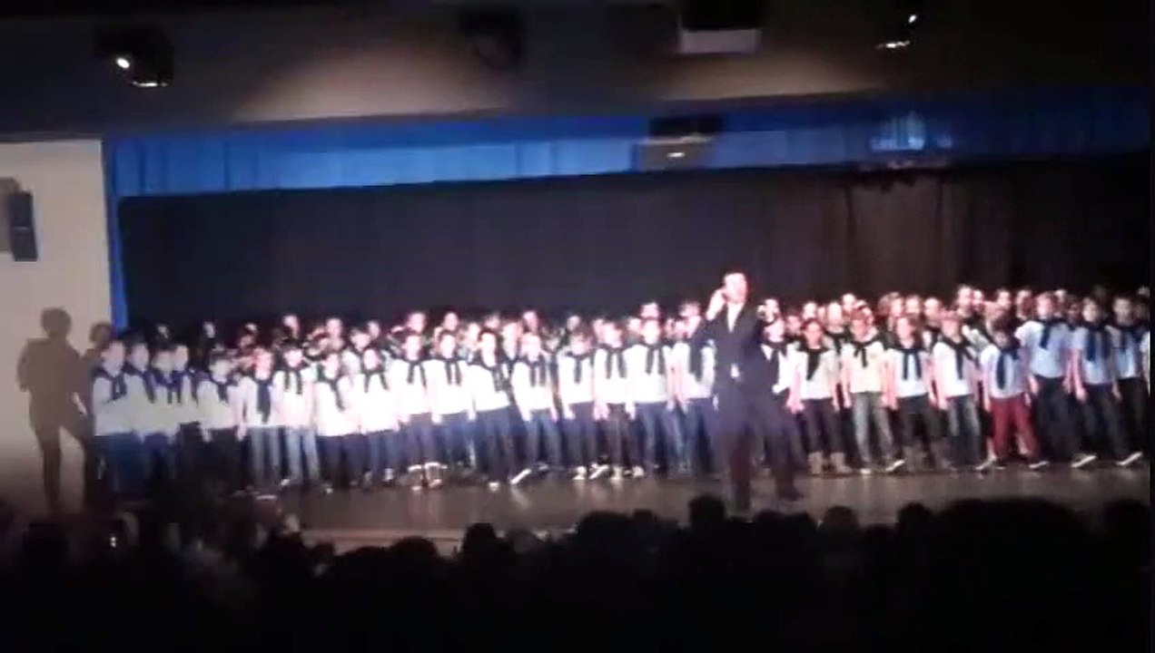 DAVID SERERO sings SINGIN IN THE RAIN with a children choir