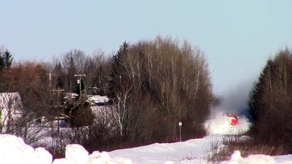 Train moves into huge pile of Snow and cuts through at high speed