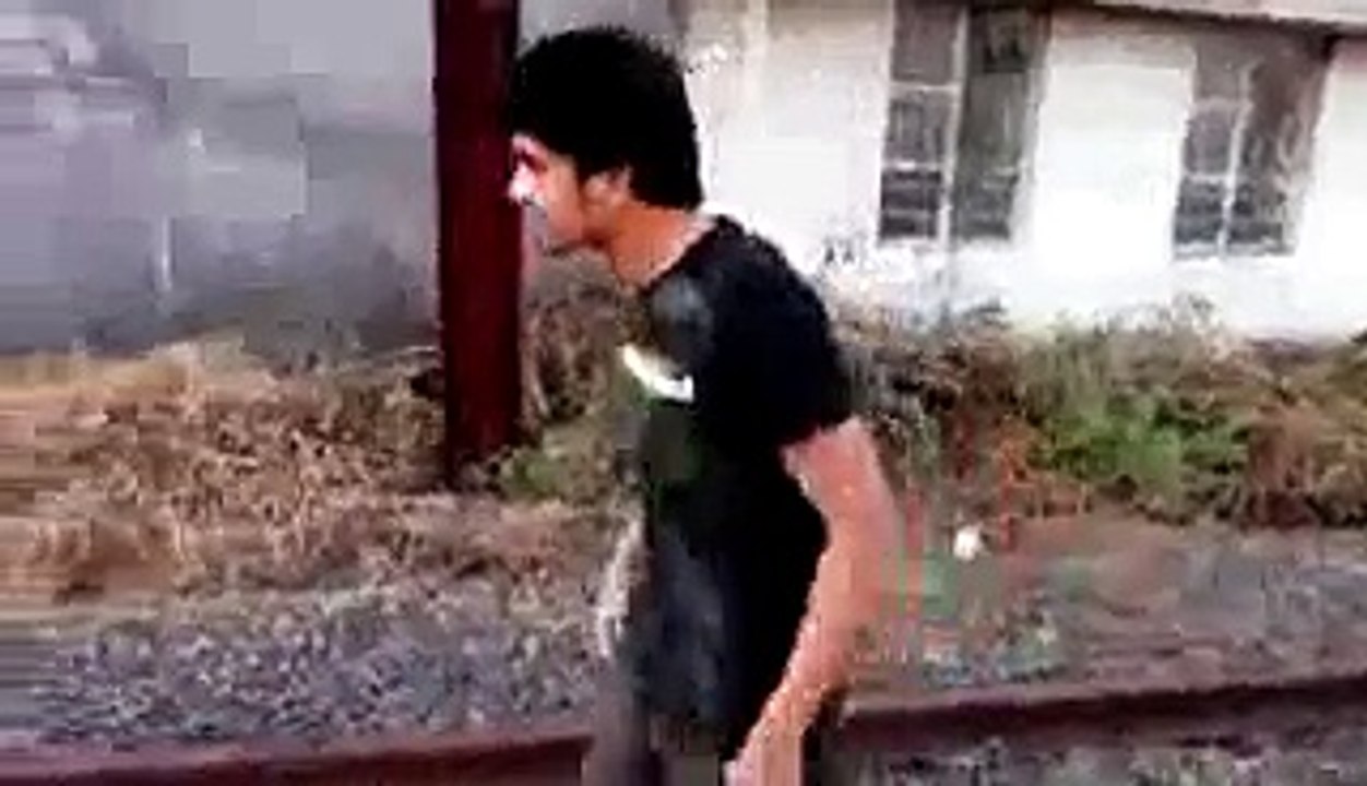 Guy committing suicide on railway track.