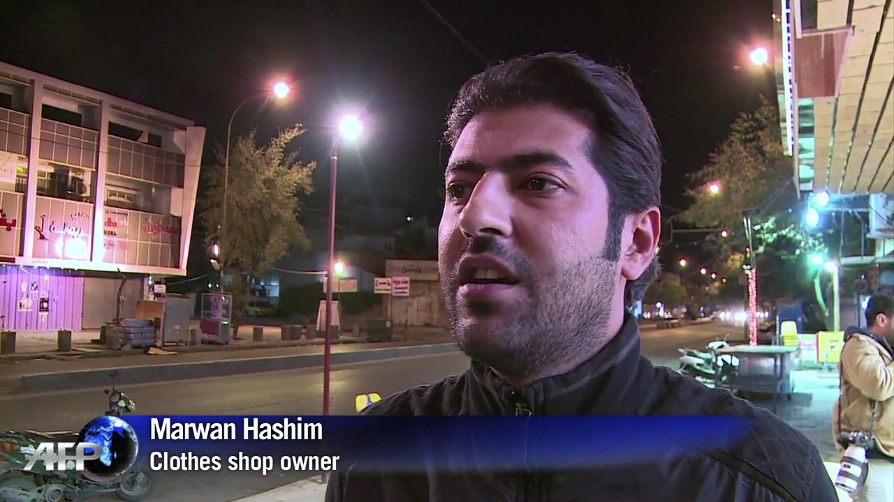 Iraqis fete curfew end with flags, horns and tyre smoke