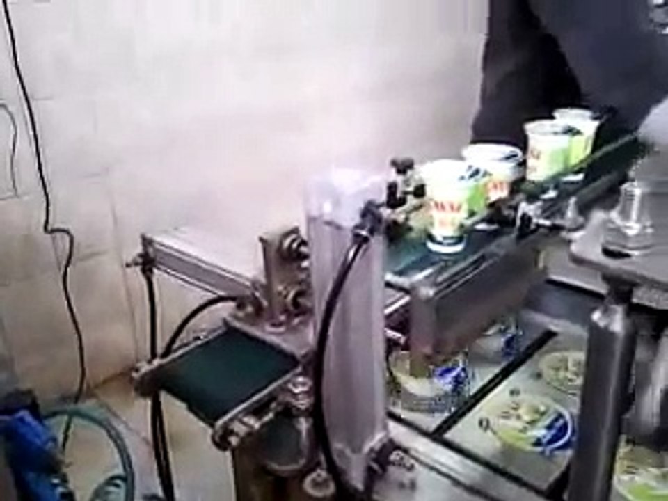 Plastic cup sealing machine