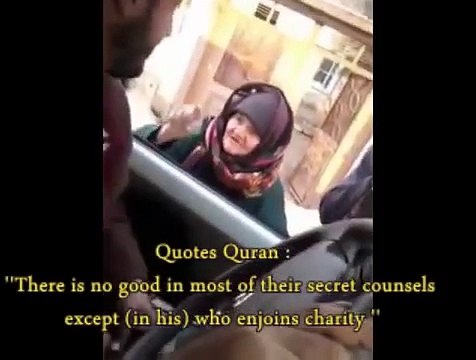 Elderly woman filmed confronting ISIS and branding them 'devil' before quoting Koran