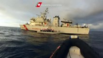 Migrants rescued by Italian coast guard arrive in Sicily