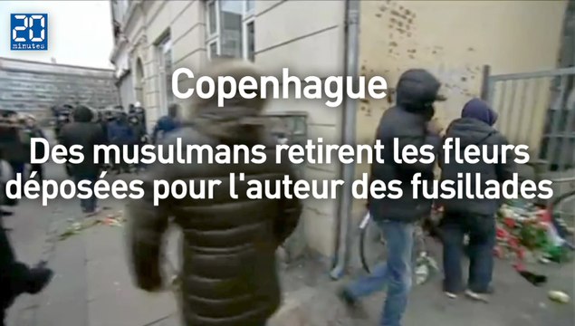 Des musulmans retirent les fleurs déposés à l'endroit où est mort l'auteur des fusillades de Copenhague