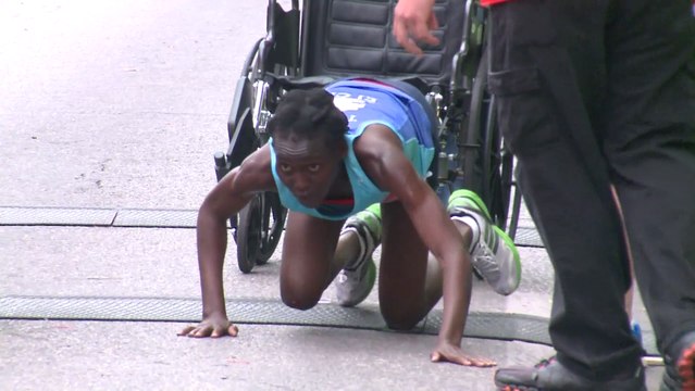 Marathoner Crawls Across Finish Line