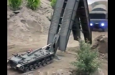 Watch This Armoured Carrier Make A Bridge In A Few Minutes!