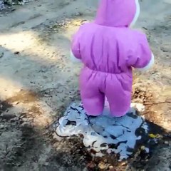 Cute baby fell down while playing with ice