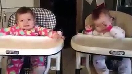 Twins babies singing with her mother.
