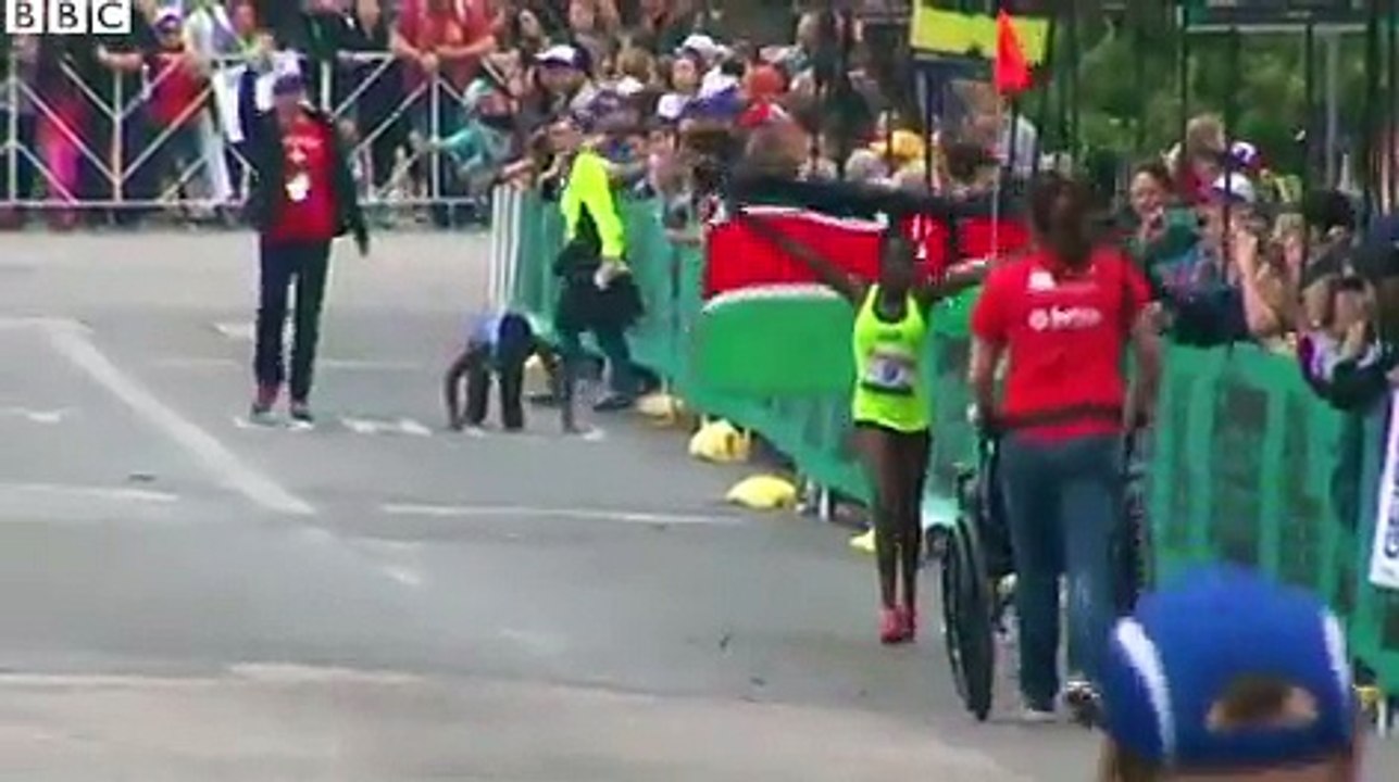 Marathon runner crawls to finish line after col...