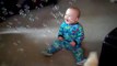 Baby laughing at dog eating bubbles