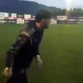 Besiktas goalkeeper Günay Güvenç scores from an impossible angle in training.