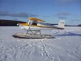 Taxing a Murphy Rebel with Full Lotus Floats on a frozen pond in Newfoundland and labrador.