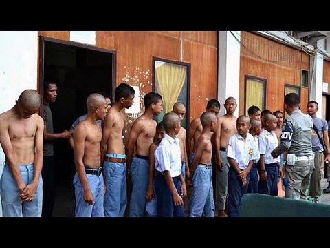 Indonesia students caught by police and get shaved heads digunguli