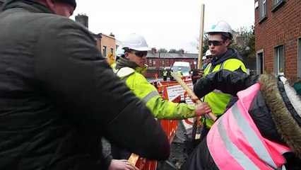 Protesters Retaking a hole and refilling it