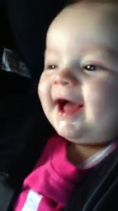 A baby laughing own his own shararat!