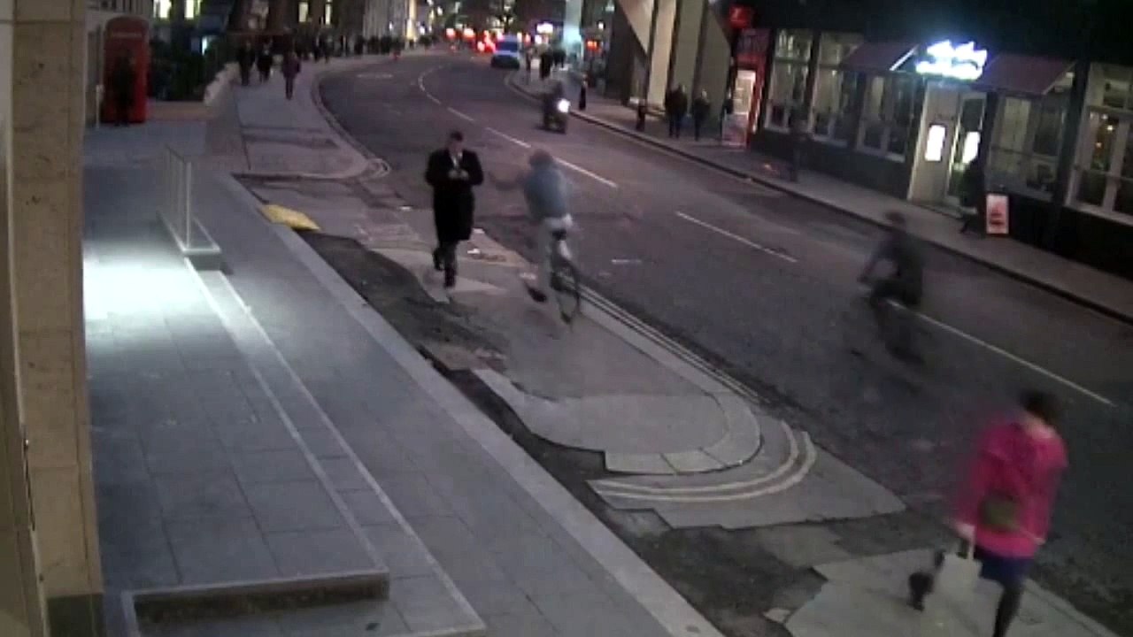 CCTV of cyclist snatching mobile phone from victim's hand in blink of an eye